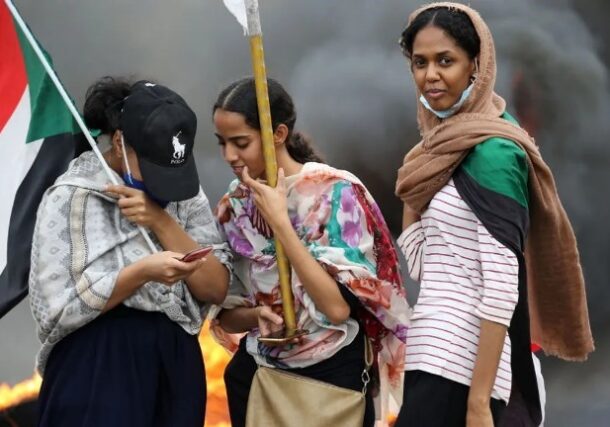 Sudanese women prepare to participate in demonstration