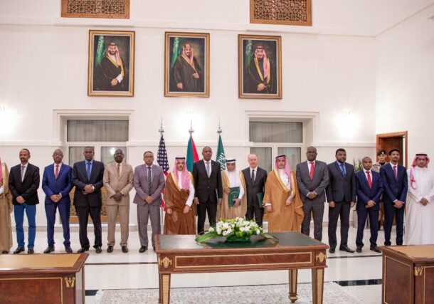Saudi foreign minister, US and Saudi ambassadors pose with the representatives of the SAF and RSF in Jeddah after the signing of the humanitarian truce on May 21, 2023